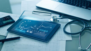 Healthcare business concept, Medical examination and growth graph data of business on tablet with doctor's health report clipboard on background.