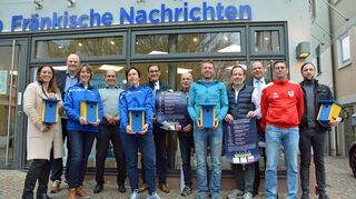 Laufserien-Organisatoren und Unterstützer unterm „Dach“ der Fränkischen Nachrichten: Nach der coronabedingten Zwangspause soll es heuer wieder losgehen mit der beliebten Veranstaltung der „Laufgemeinschaft Tauberfranken“. Spenden kommen örtlichen Ukraine-Hilfen zugute.