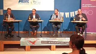 Podiumsdiskussion: Das Bild zeigt (von links) Dr. Mark Fraschka, Marcel Emmerich, Patrick Haag sowie Georg Heitlinger.